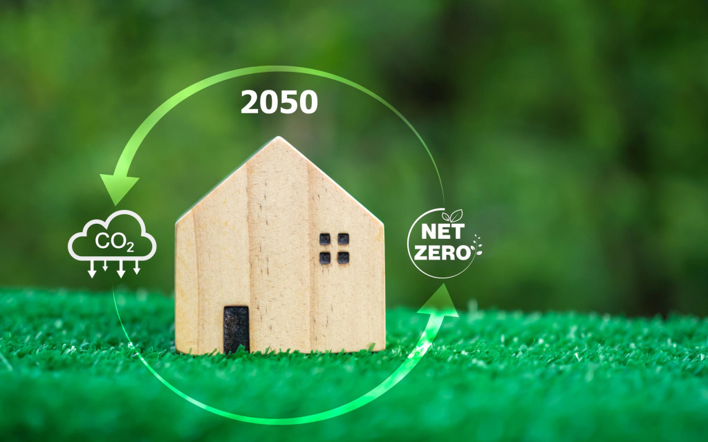 image représentant une maison en bois sur une pelouse